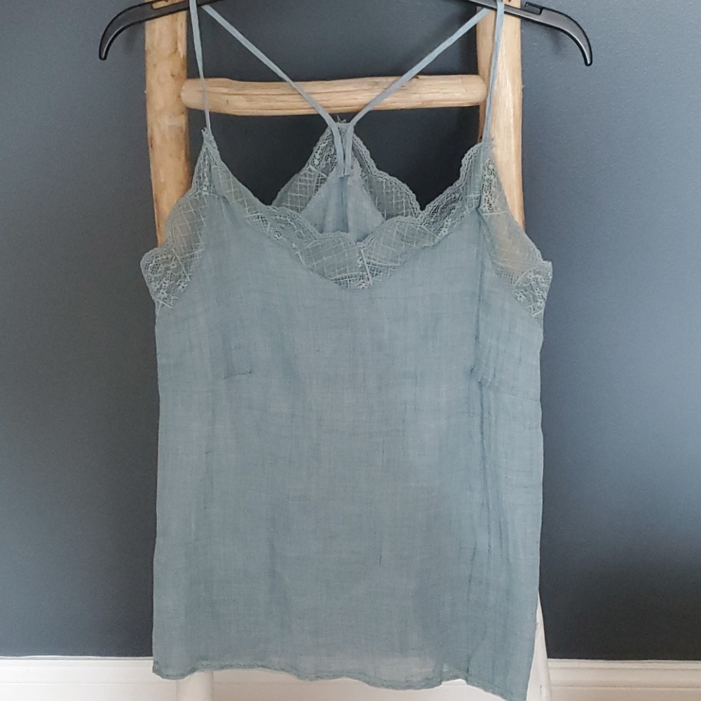 This is a light blue lace-trim camisole top. Small